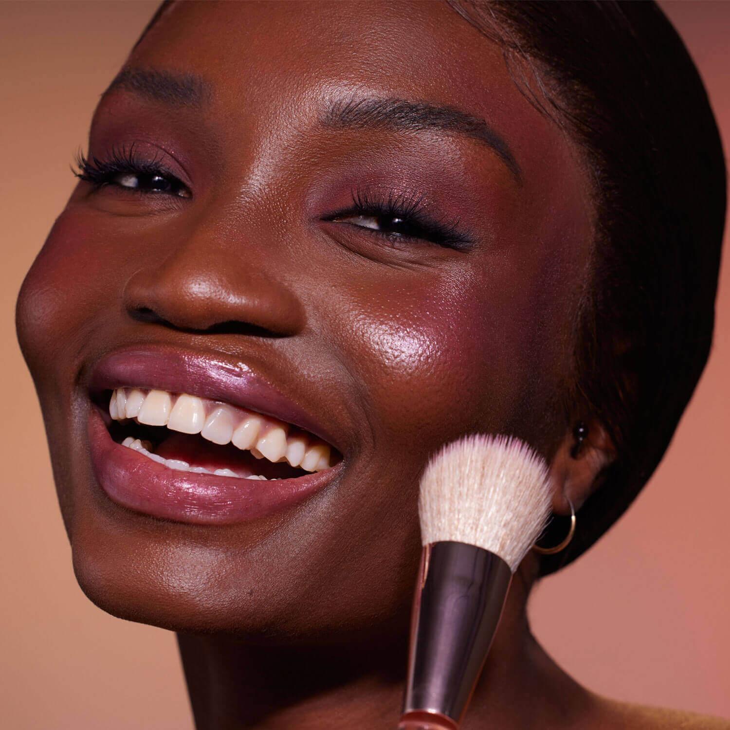 Model with cheeky blush tint applied.